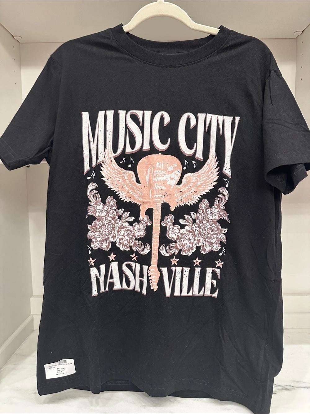Pink Lily small back tee shirt.  Music City Nashville logo Like new